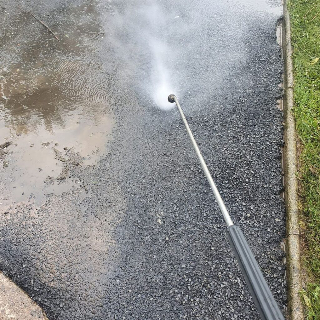 The process of a driveway being cleaned in Clare