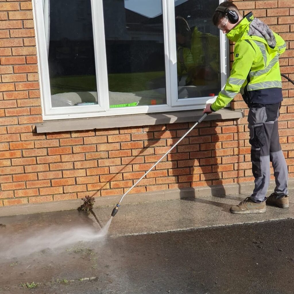 Pressure washing outside a property in Clare
