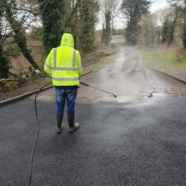 The Premier Power Washin team outside a property in Clare